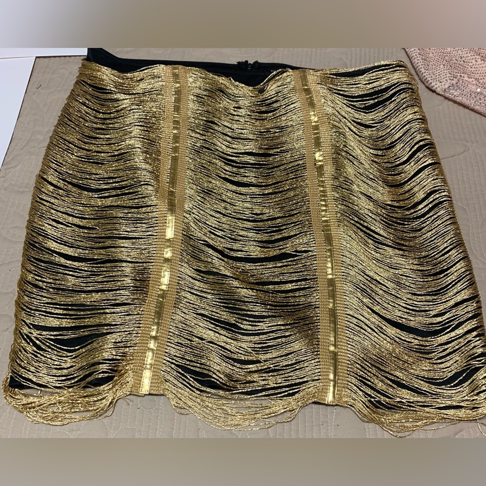 Black mini skirt with gold detail